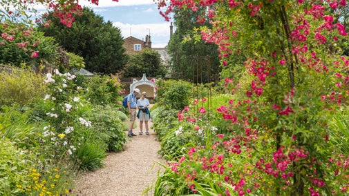 Visitors in the garden in July at Peckover House, Cambridgeshire